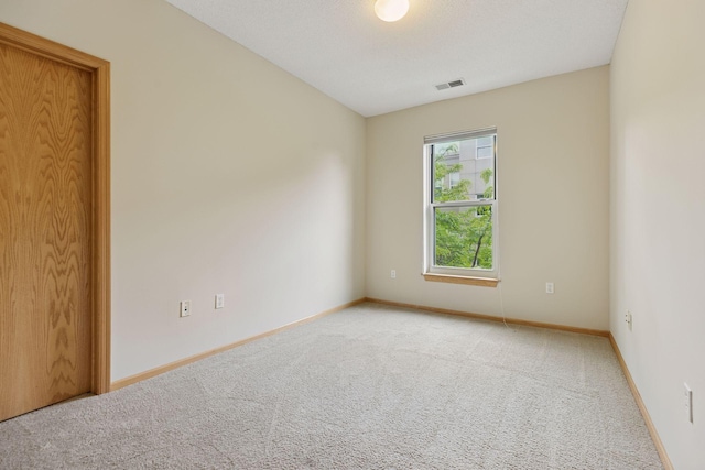 645 1st St Unit 411, Minneapolis, MN 55401 - carpeted spare room featuring baseboards