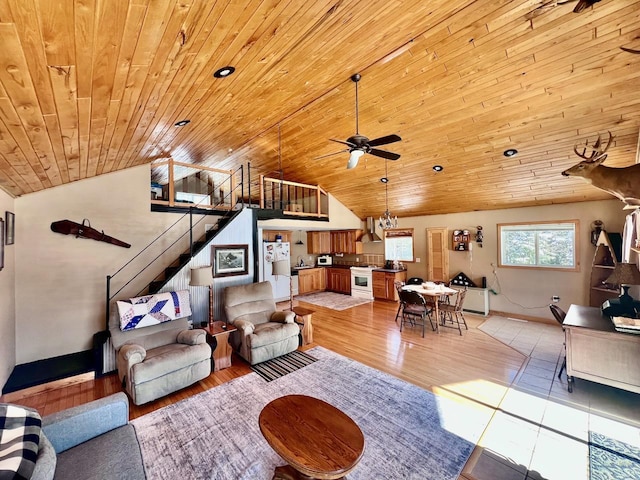 4832 Ambassador Point Ct, Leiding Twp, MN 55771 - living room with stairs, vaulted ceiling, a ceiling fan, light wood-style floors, and wood ceiling
