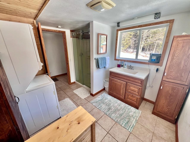 4832 Ambassador Point Ct, Leiding Twp, MN 55771 - full bathroom with a shower stall, baseboards, tile patterned floors, toilet, and a textured ceiling