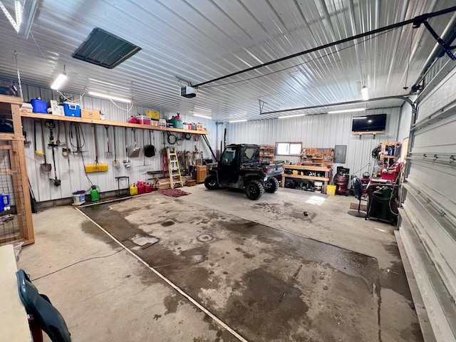 4832 Ambassador Point Ct, Leiding Twp, MN 55771 - garage featuring a workshop area and a garage door opener