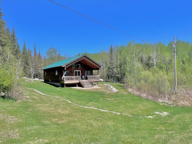 4832 Ambassador Point Ct, Leiding Twp, MN 55771 - back of property featuring a forest view, a lawn, and a deck