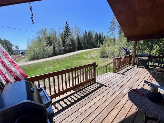 4832 Ambassador Point Ct, Leiding Twp, MN 55771 - wooden deck featuring grilling area and a lawn