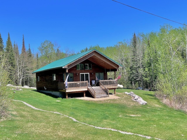 4832 Ambassador Point Ct, Leiding Twp, MN 55771 - view of front of house with a front lawn, a forest view, and a wooden deck