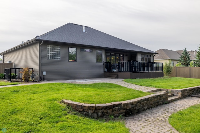 4109 66th St S, West Fargo, ND 58104 - rear view of house featuring a fenced backyard, a shingled roof, and a patio