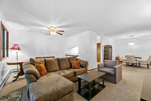 living area with a baseboard radiator, carpet flooring, and a ceiling fan