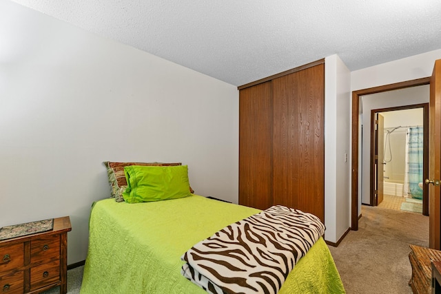 bedroom with a closet and light colored carpet