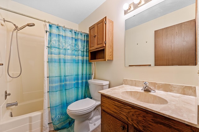 bathroom featuring shower / bath combo, vanity, and toilet