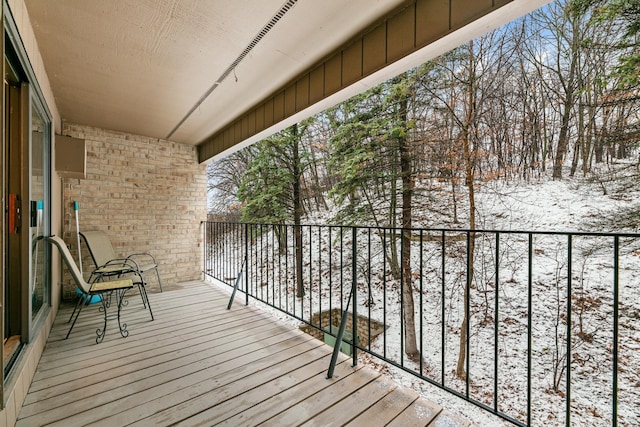 view of snow covered deck