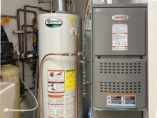 utilities with heating unit and gas water heater