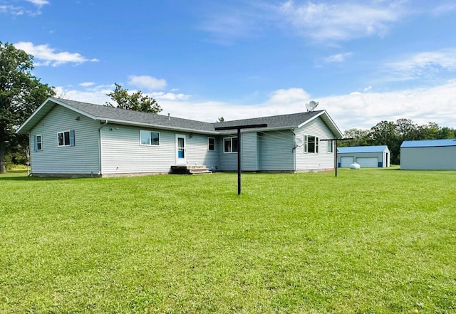 16335 County Road 2, Brainerd, MN 56401 - back of house featuring a lawn, an outbuilding, and entry steps