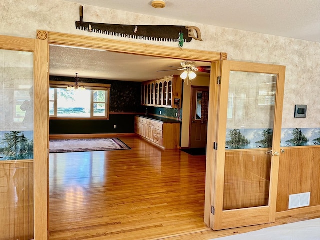 16335 County Road 2, Brainerd, MN 56401 - kitchen featuring wood finished floors, ceiling fan, and a chandelier