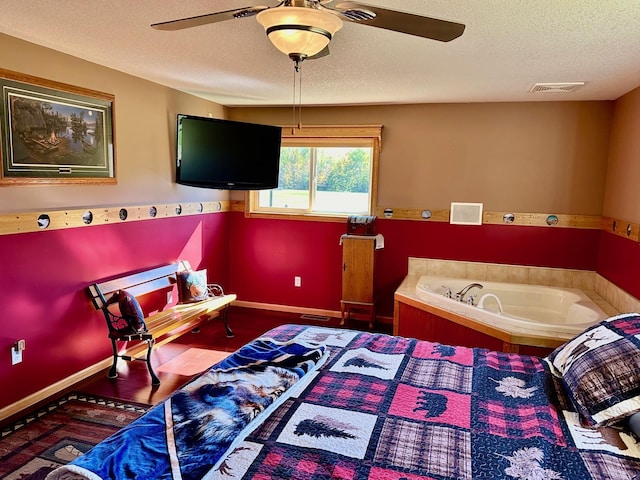 16335 County Road 2, Brainerd, MN 56401 - bedroom with a textured ceiling, baseboards, ceiling fan, and wood finished floors