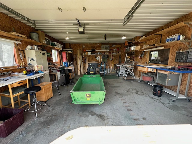 16335 County Road 2, Brainerd, MN 56401 - garage featuring a workshop area and a garage door opener