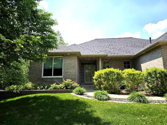 6380 Highland Hills Blvd S, Cottage Grove, MN 55016 - view of front of home featuring brick siding and a front lawn