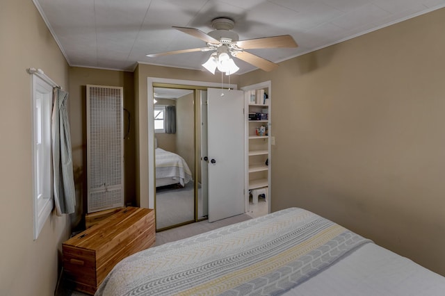 5591 Wildwood Ave, Isle, MN 56342 - carpeted bedroom featuring a heating unit, ornamental molding, a closet, and ceiling fan