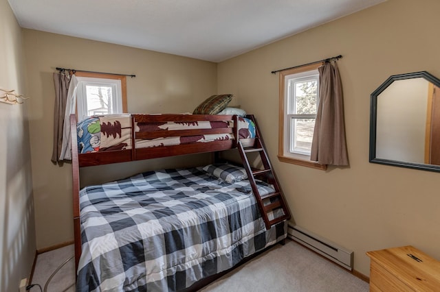 5591 Wildwood Ave, Isle, MN 56342 - bedroom featuring baseboard heating, carpet floors, multiple windows, and baseboards