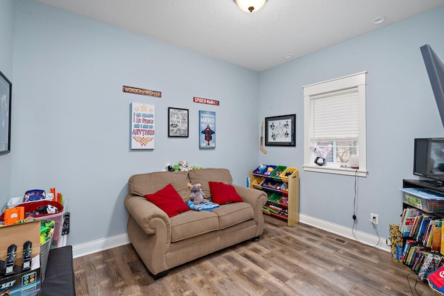 5234 Grand Ave, White Bear Twp, MN 55110 - game room with baseboards, wood finished floors, and a textured ceiling