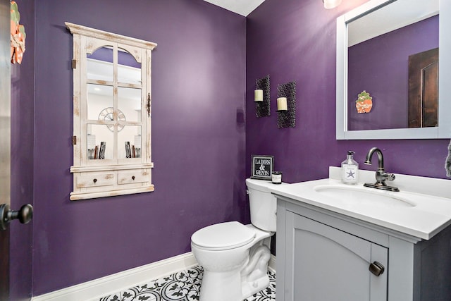 5234 Grand Ave, White Bear Twp, MN 55110 - bathroom with toilet, vanity, tile patterned flooring, and baseboards