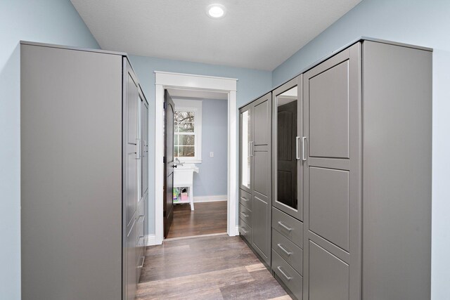 5234 Grand Ave, White Bear Twp, MN 55110 - hall with baseboards and wood finished floors