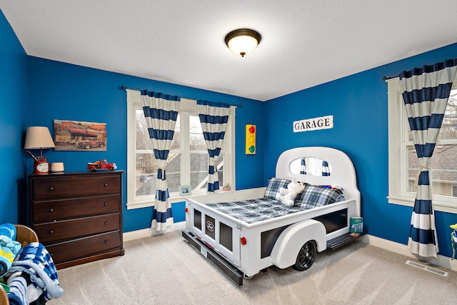 5234 Grand Ave, White Bear Twp, MN 55110 - carpeted bedroom featuring a textured ceiling, baseboards, and visible vents