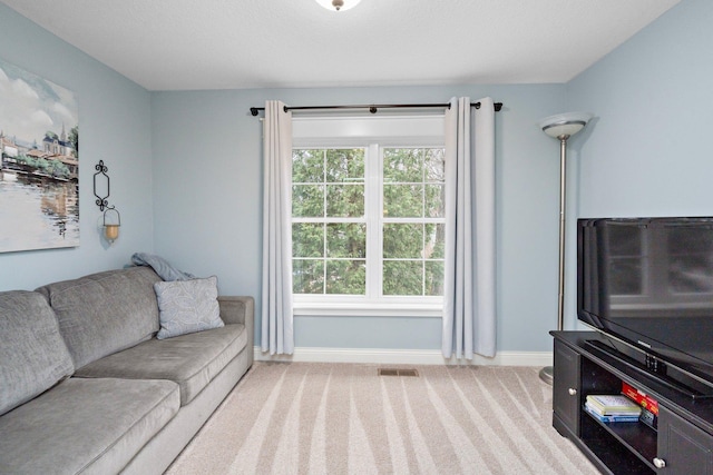 5234 Grand Ave, White Bear Twp, MN 55110 - living room featuring light colored carpet, visible vents, and baseboards
