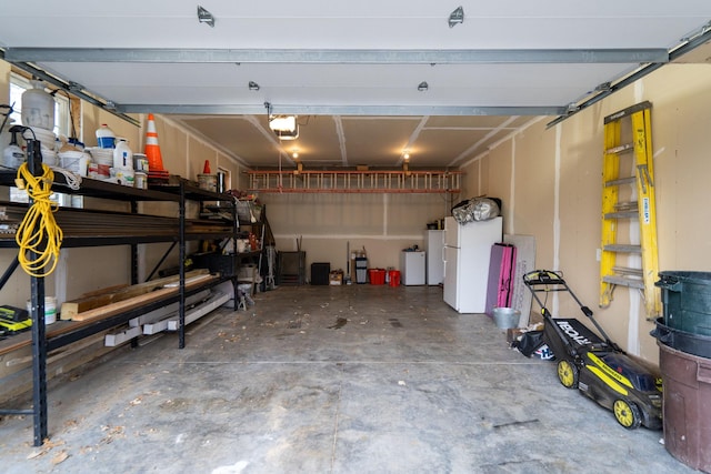5234 Grand Ave, White Bear Twp, MN 55110 - garage featuring a garage door opener and freestanding refrigerator