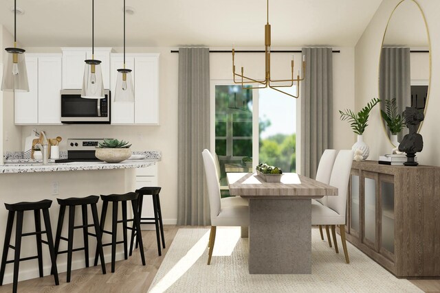 dining space featuring baseboards, light wood finished floors, and a chandelier