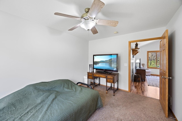 bedroom featuring carpet floors, a ceiling fan, and baseboards