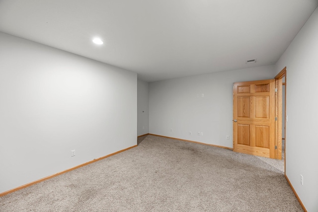 carpeted spare room with baseboards and recessed lighting