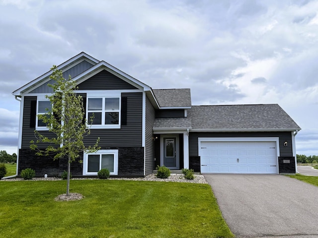 521 Douglas Dr S, Annandale, MN 55302 - view of front facade with driveway, a front yard, an attached garage, roof with shingles, and board and batten siding