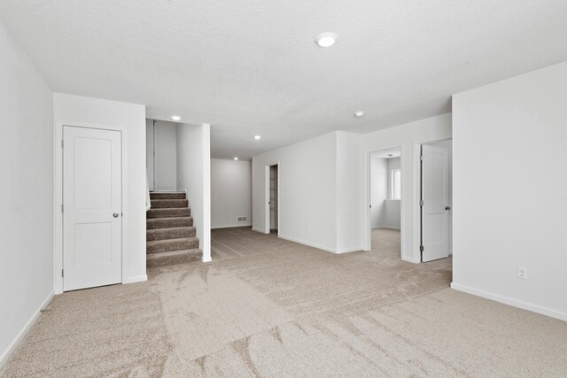 521 Douglas Dr S, Annandale, MN 55302 - spare room featuring carpet floors, stairs, and recessed lighting