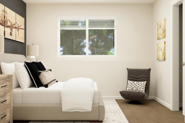 carpeted bedroom featuring baseboards