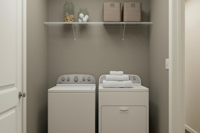 clothes washing area with laundry area and separate washer and dryer