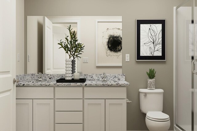 bathroom with toilet, a sink, double vanity, and a stall shower