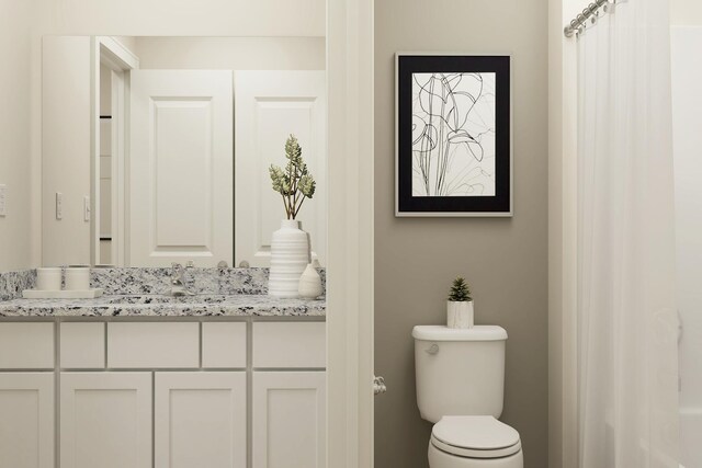 full bathroom featuring toilet and vanity