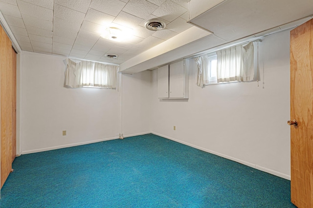 below grade area with plenty of natural light, carpet, and visible vents