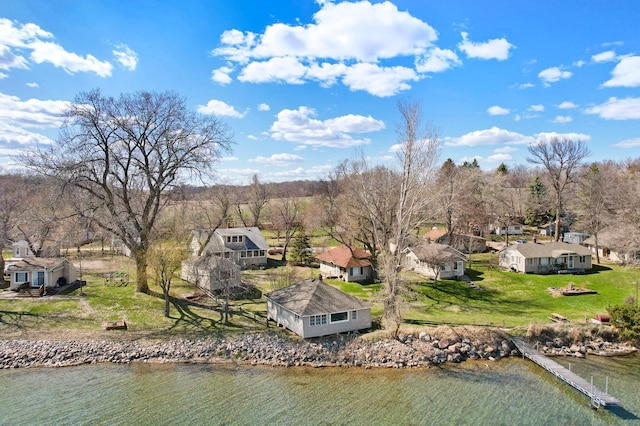 bird's eye view featuring a water view and a residential view