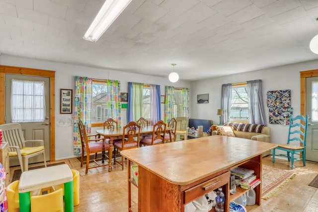 kitchen with hanging light fixtures, a breakfast bar, and a center island