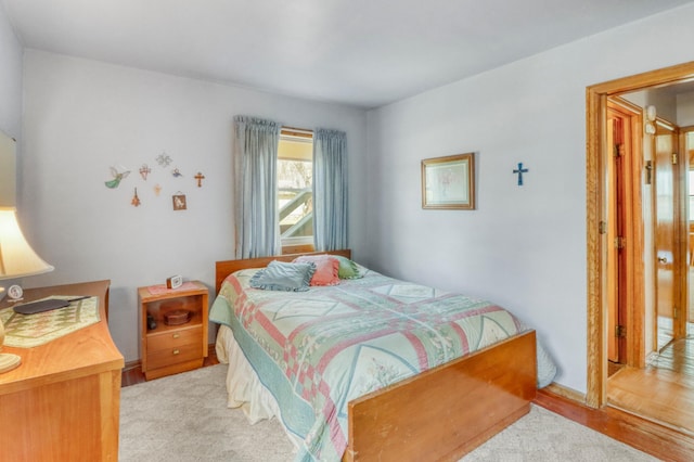 bedroom featuring light wood-style floors