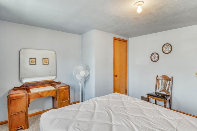 carpeted bedroom with baseboards