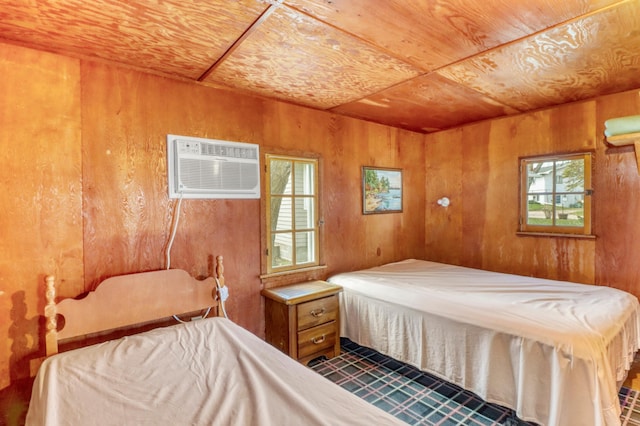 bedroom featuring wood ceiling, an AC wall unit, and wood walls