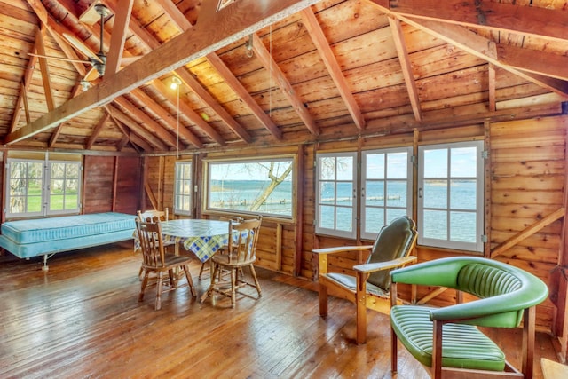 sunroom featuring french doors and beamed ceiling