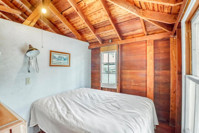 bedroom featuring wood finished floors, lofted ceiling with beams, wood walls, and wooden ceiling