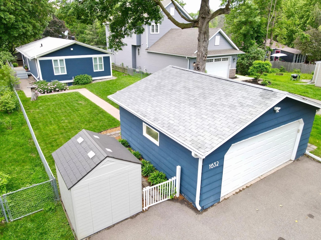1632 Eagle Ln, Mound, MN 55364 - view of front of house featuring a detached garage and roof with shingles