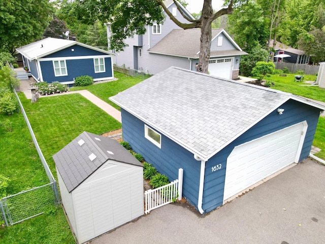 1632 Eagle Ln, Mound, MN 55364 - view of front of house featuring a detached garage and roof with shingles