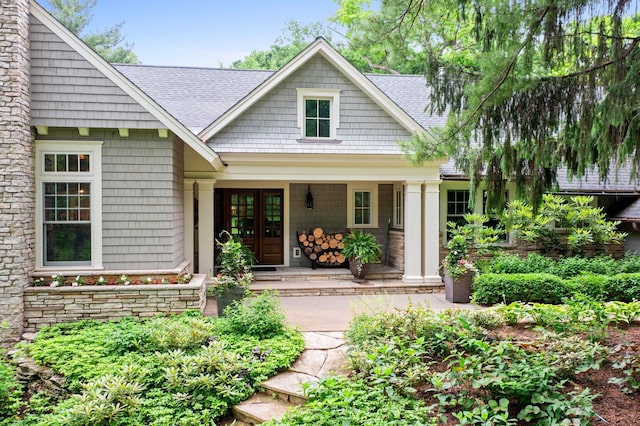 6601 Blackfoot Pass, Edina, MN 55439 - doorway to property with a shingled roof, french doors, and a porch