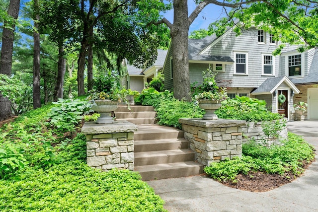 6601 Blackfoot Pass, Edina, MN 55439 - exterior space featuring driveway, a shingled roof, and a garage