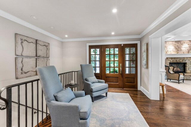 6601 Blackfoot Pass, Edina, MN 55439 - living area featuring a stone fireplace, dark wood-style floors, recessed lighting, and ornamental molding