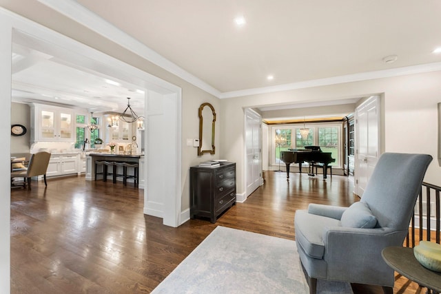 6601 Blackfoot Pass, Edina, MN 55439 - living area with crown molding, baseboards, recessed lighting, dark wood-style floors, and an inviting chandelier