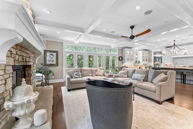 6601 Blackfoot Pass, Edina, MN 55439 - living room with coffered ceiling, beam ceiling, wood finished floors, ceiling fan with notable chandelier, and ornamental molding